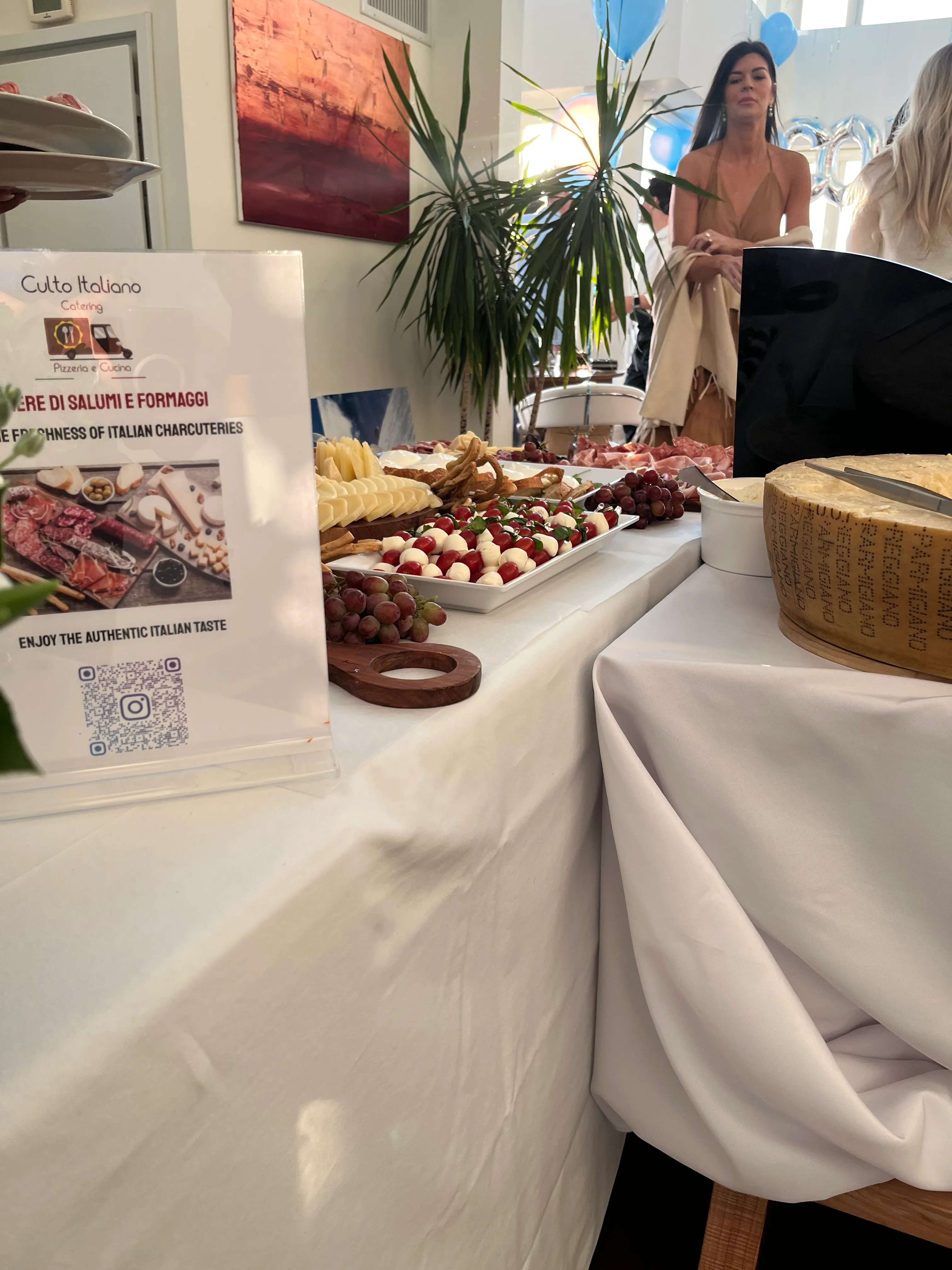 A Culto Italiano catering buffet with the Culto Italiano Catering sign