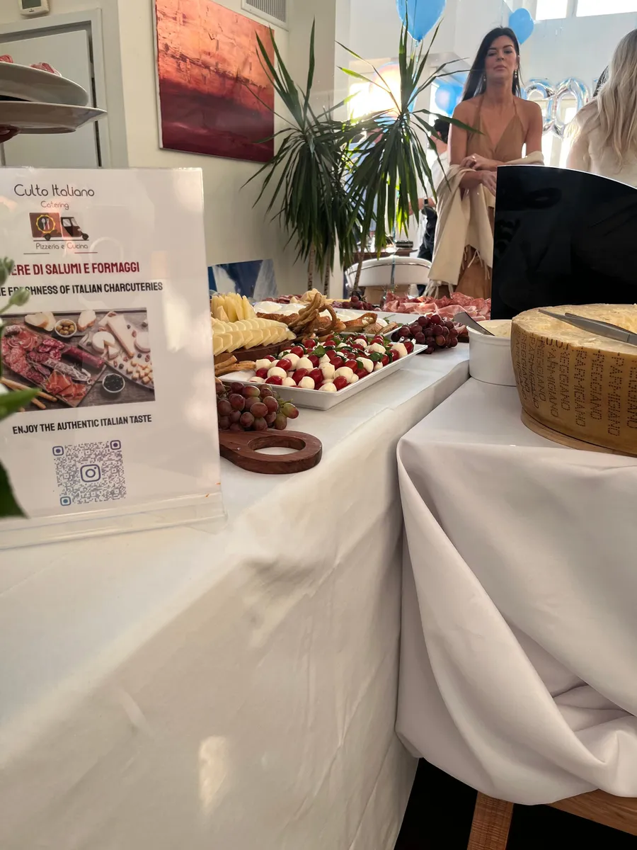 A charcuterie and cheese table at a Culto Italiano catered event