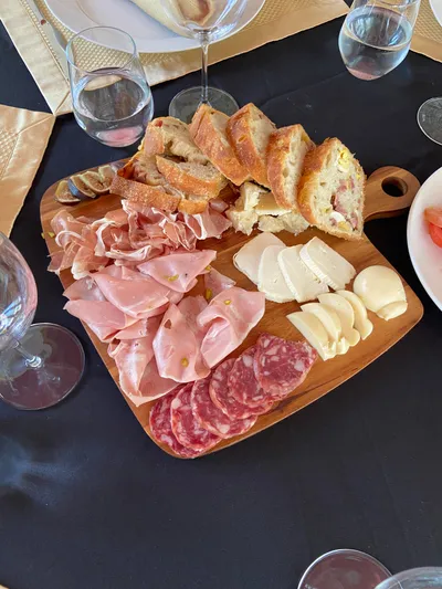 An Italian charcuterie board with prosciutto, salame and cheese