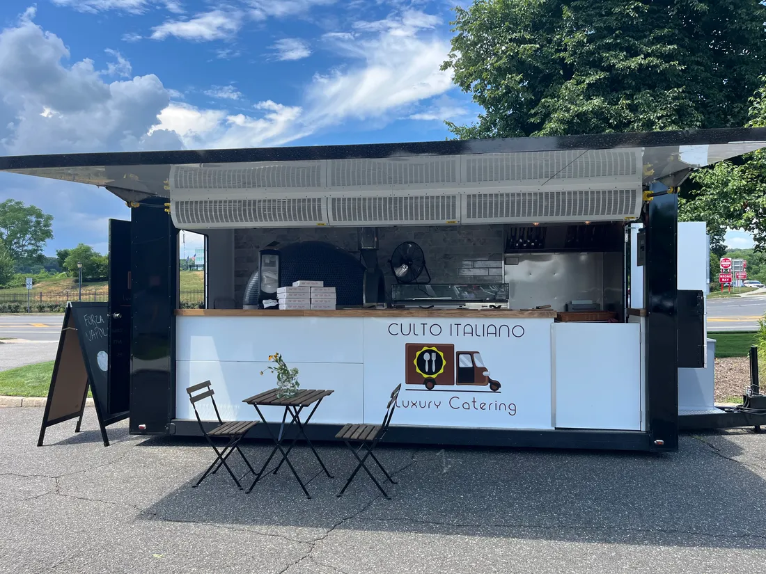 The Culto Italiano branded mobile pizza trailer, set up and ready for an event